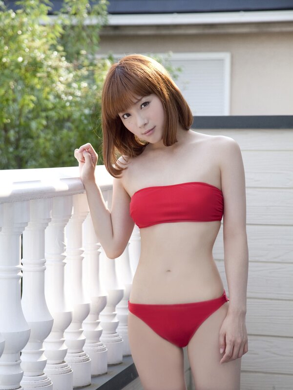 Woman in red bikini on balcony