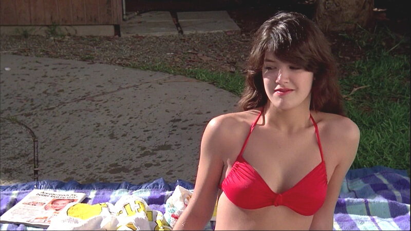 woman in red bikini on blanket