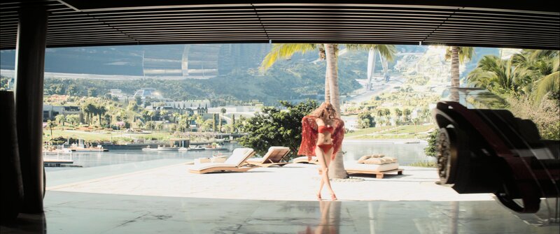 Woman in red bikini on patio