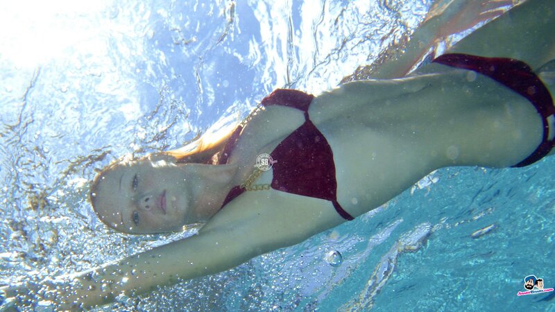 woman in red bikini underwater