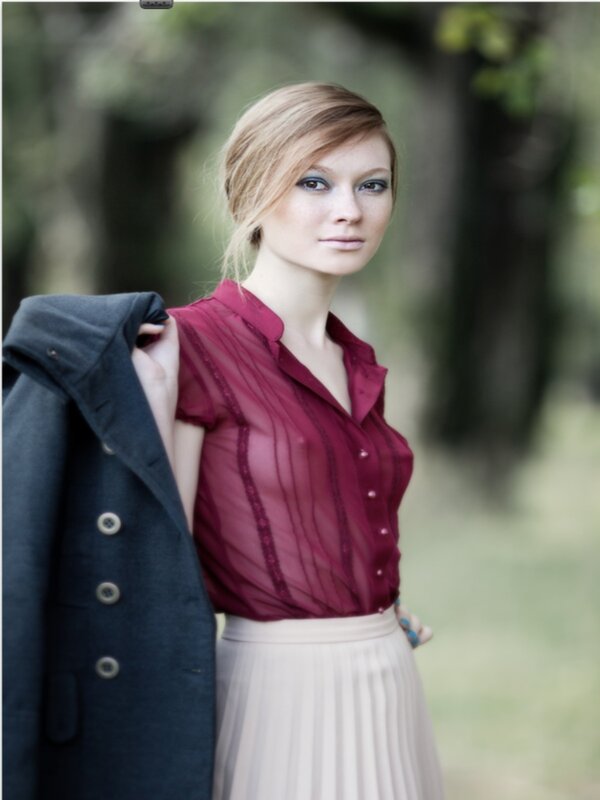 woman in red blouse outdoors