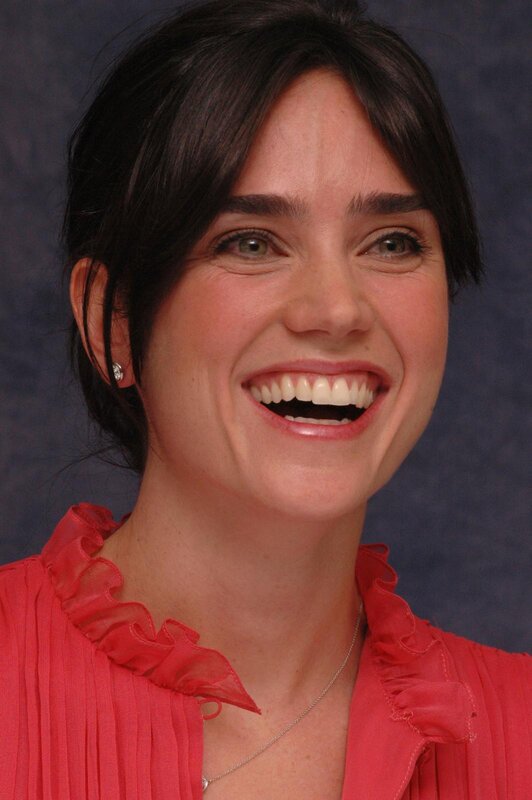 woman in red blouse smiling