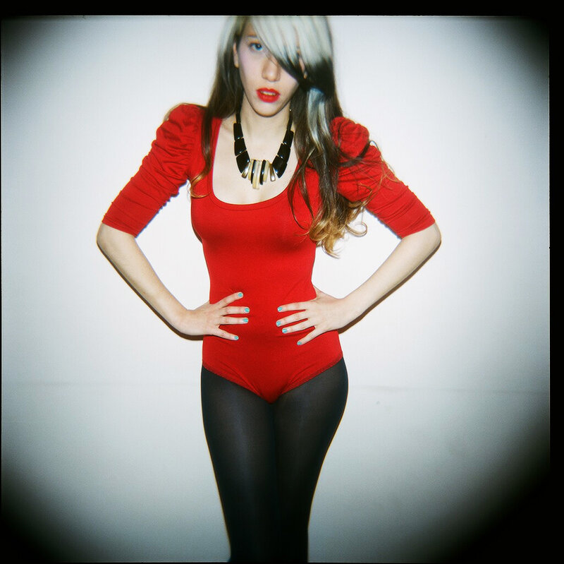 Woman in Red Bodysuit — Confident