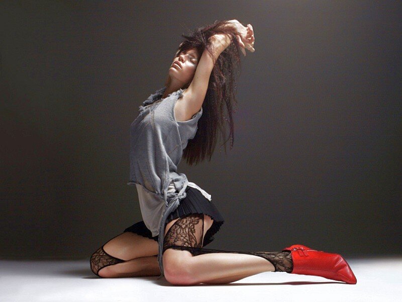 woman in red boots posing