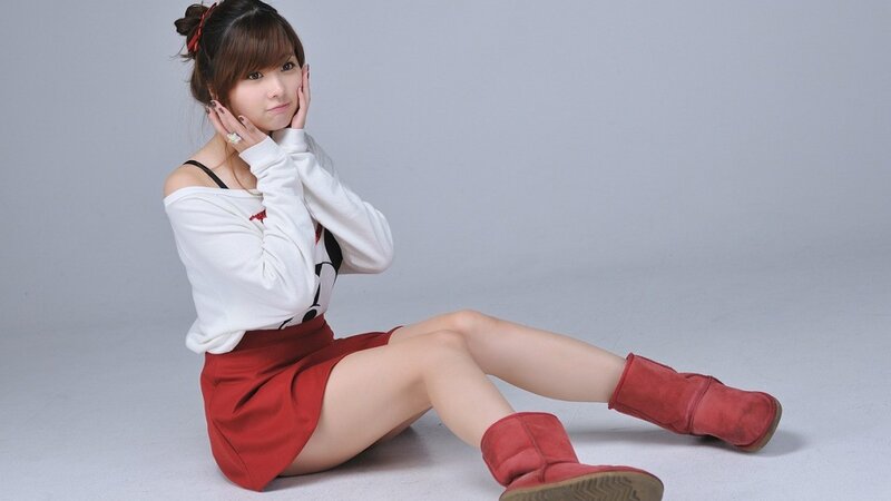 woman in red boots sitting