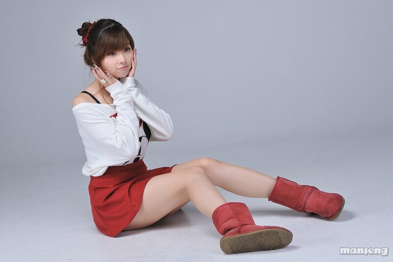 woman in red boots sitting