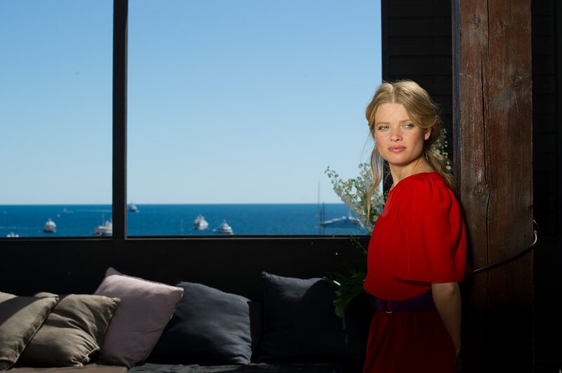 Woman in red by the sea