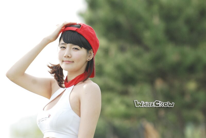 woman in red cap and white top