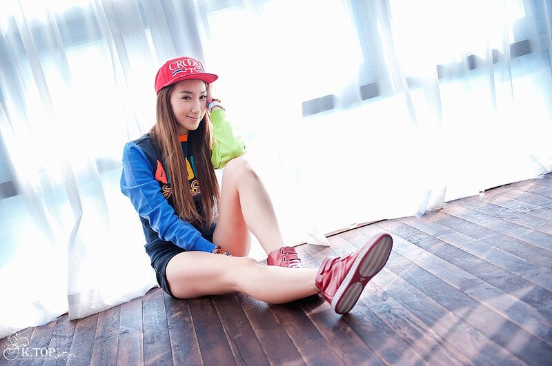 woman in red cap sitting on floor