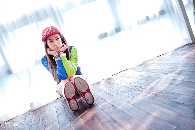 woman in red cap sitting on floor