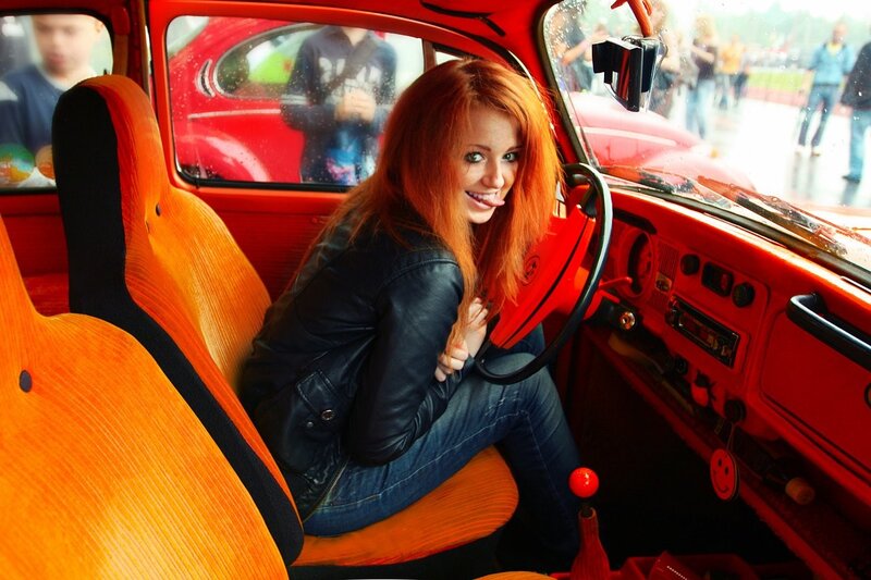 Woman in red car interior