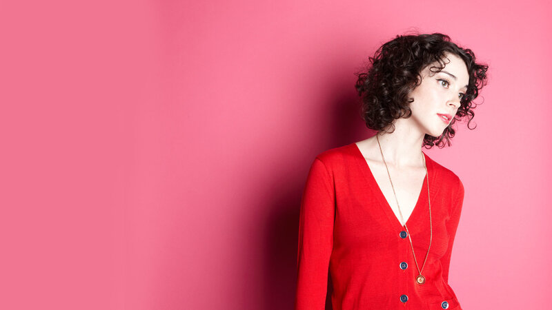 woman in red cardigan
