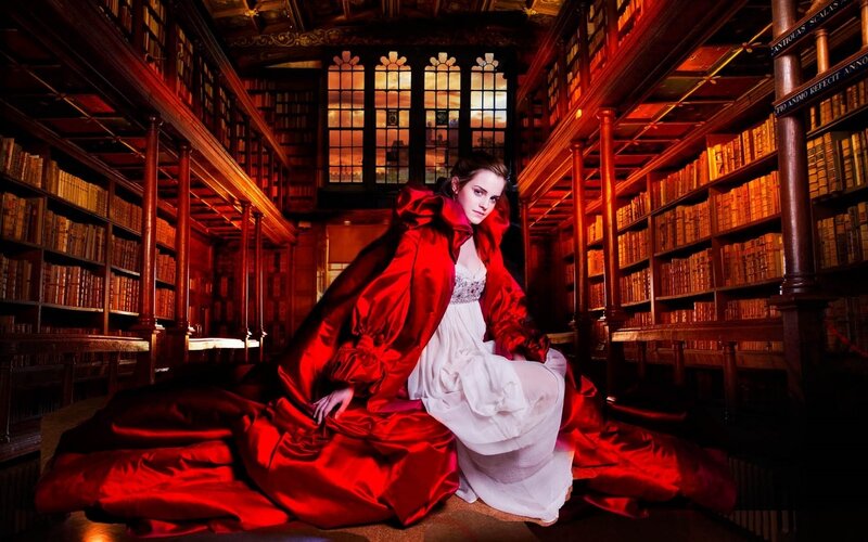 Woman in red cloak in library