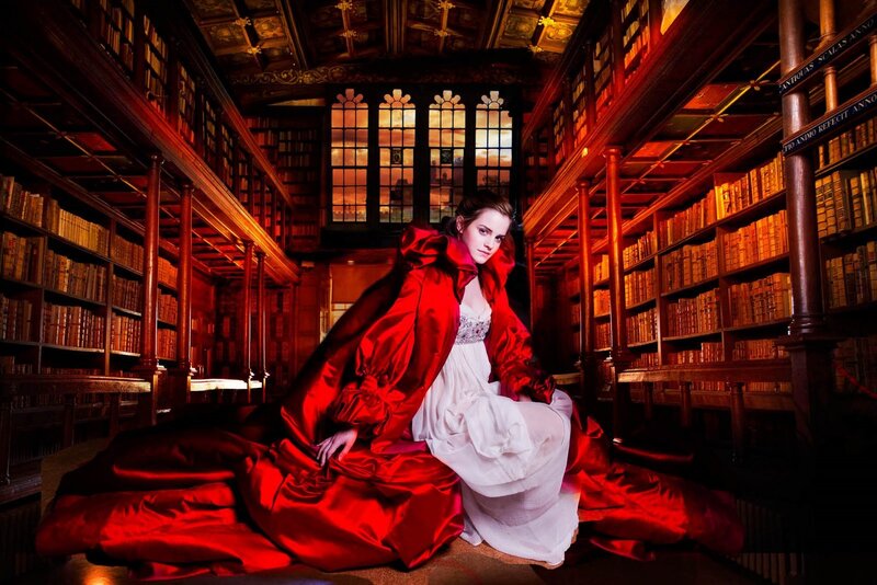 Woman in red cloak in library