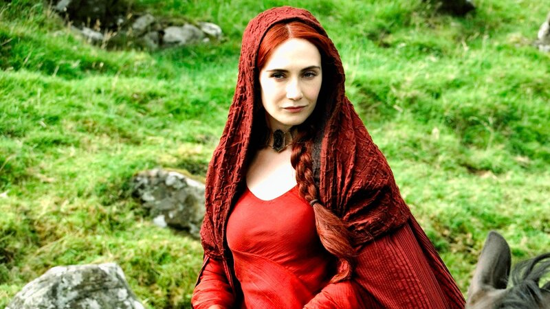 woman in red cloak outdoors