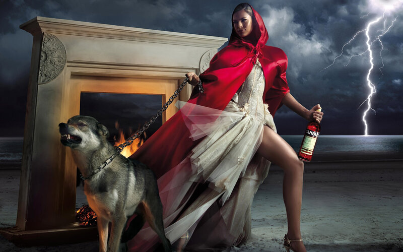 Woman in red cloak with wolf