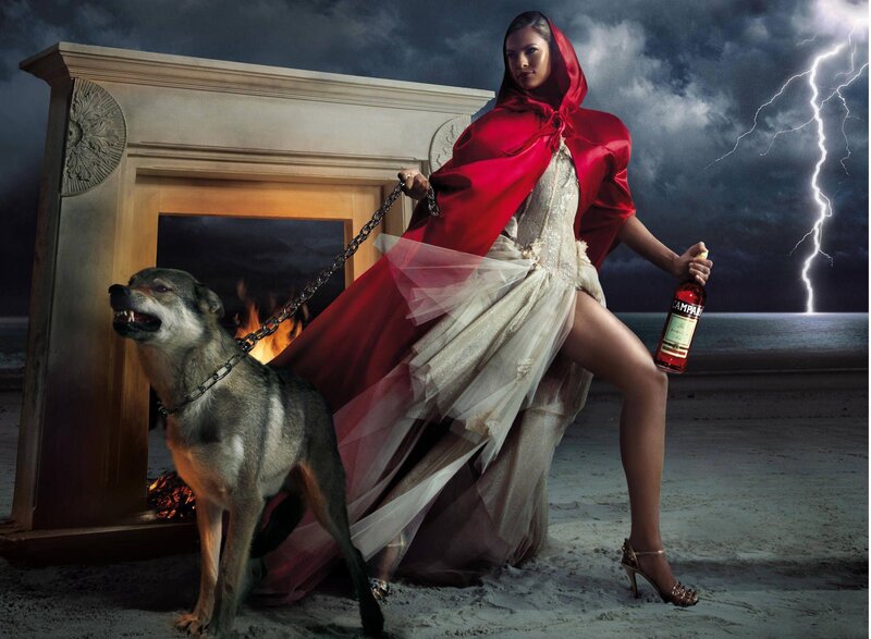 Woman in red cloak with wolf