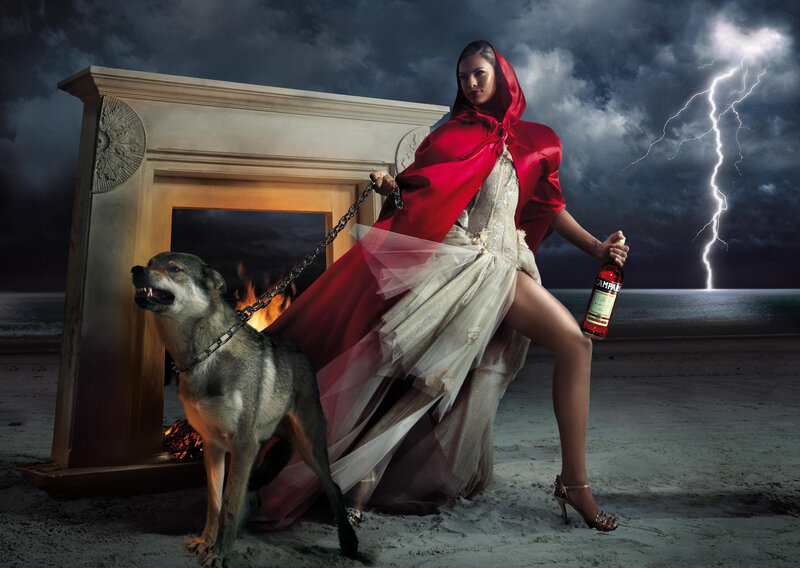 Woman in red cloak with wolf