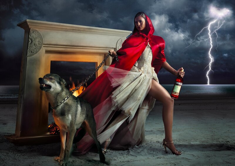 Woman in red cloak with wolf