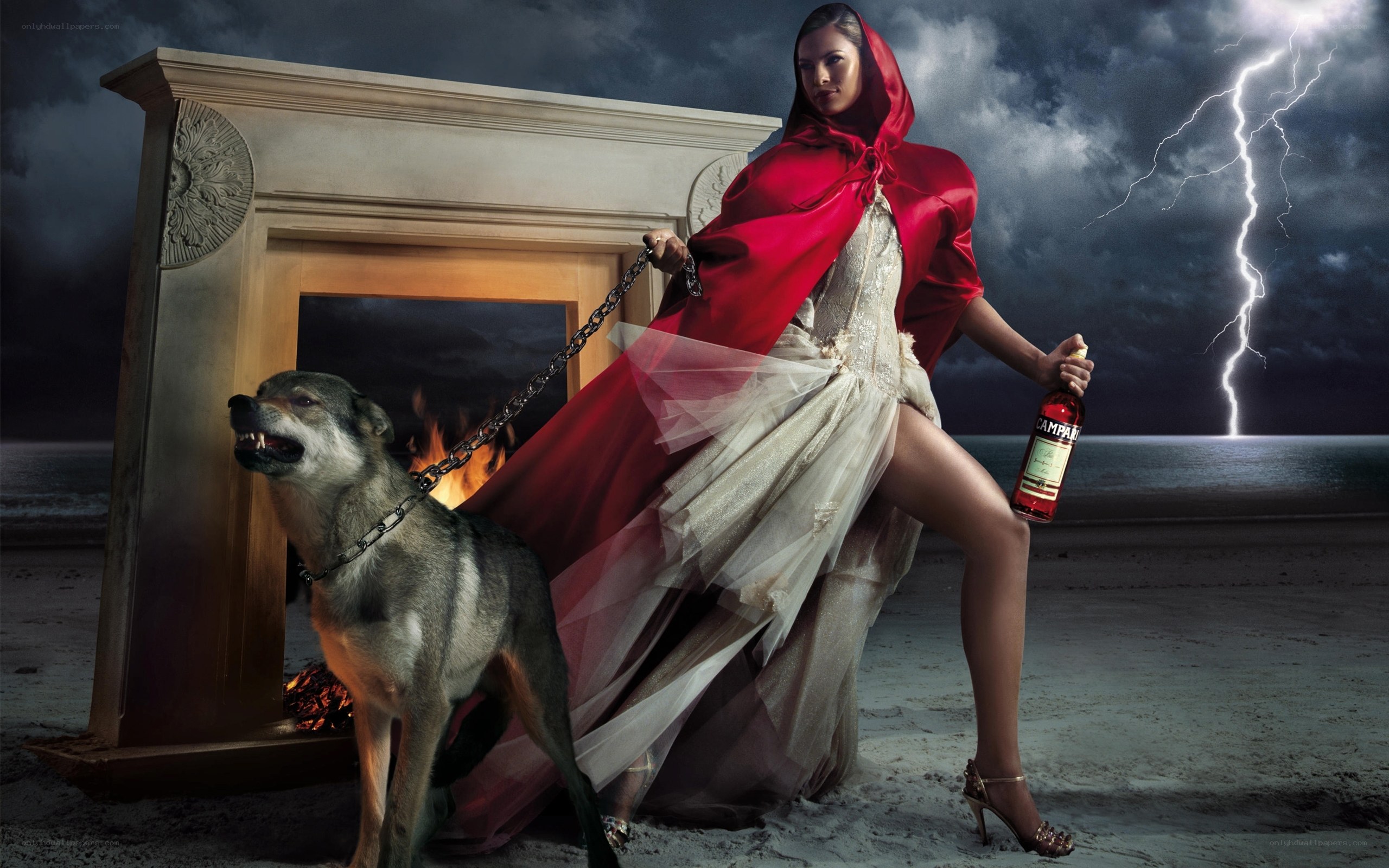 Woman in red cloak with wolf