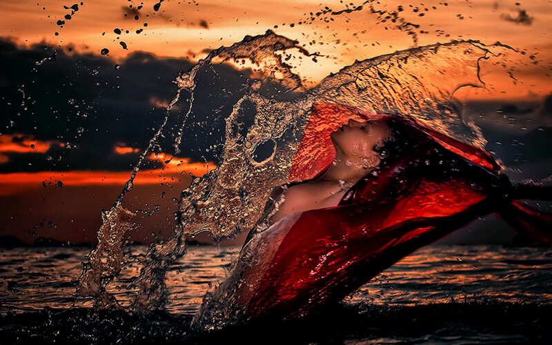 woman in red cloth at sunset