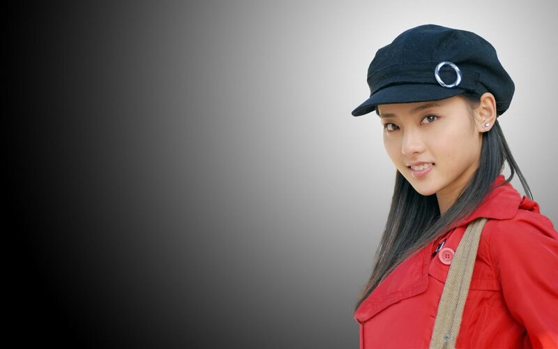 woman in red coat and cap