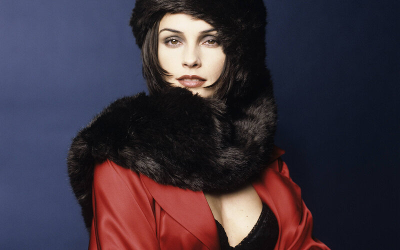 woman in red coat and fur hat