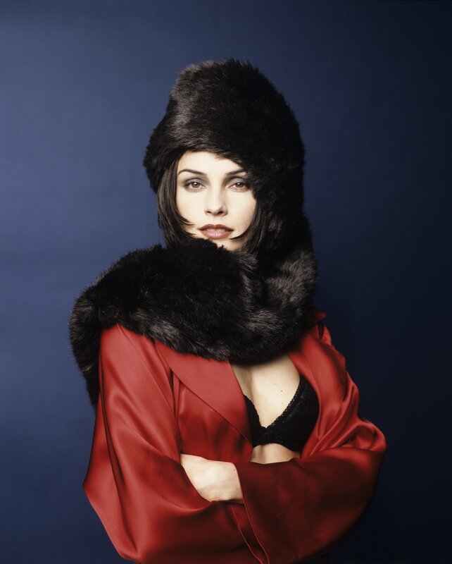 woman in red coat and fur hat