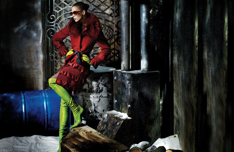 Woman in red coat and green boots
