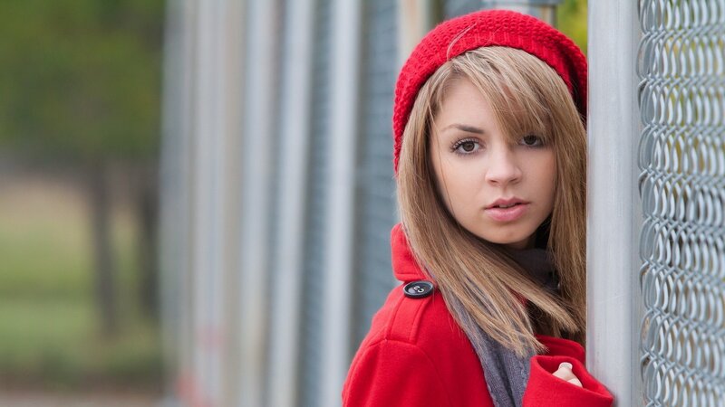woman in red coat and hat