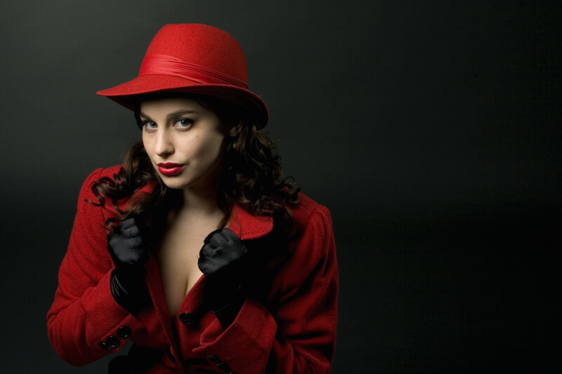 woman in red coat and hat