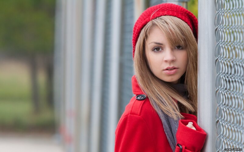 woman in red coat and hat