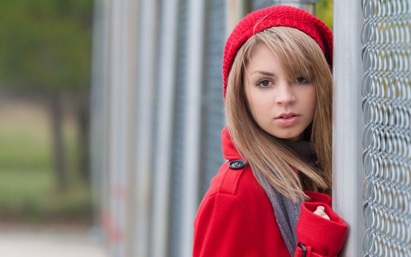 woman in red coat and hat
