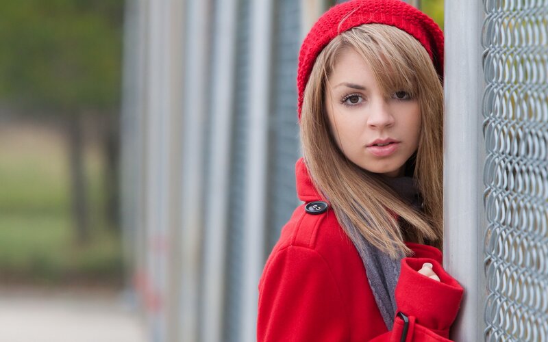 woman in red coat and hat