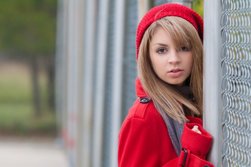 woman in red coat and hat