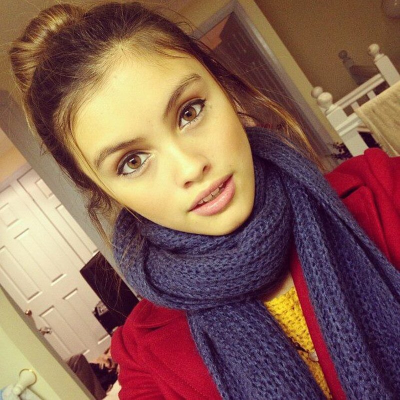 woman in red coat and scarf