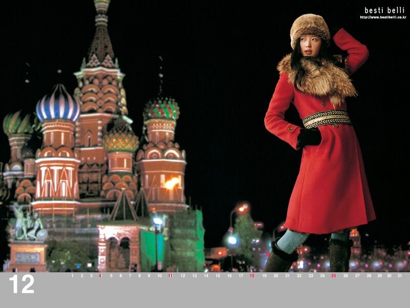 Woman in red coat at night