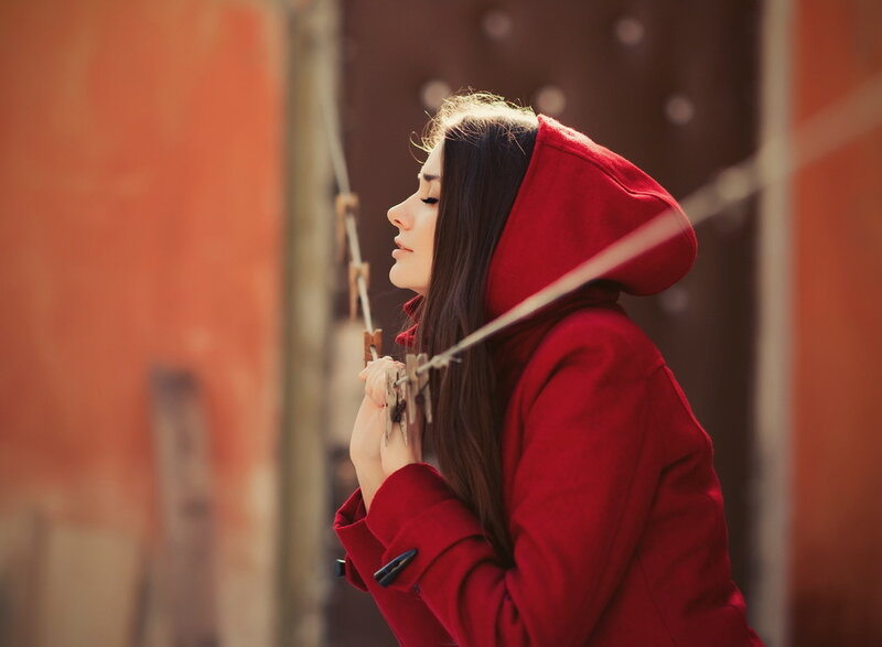 Woman in Red Coat — Contemplative