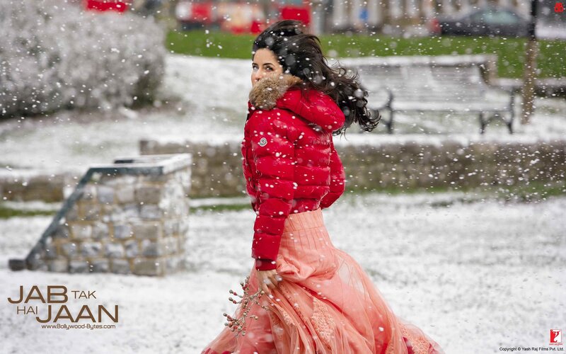 woman in red coat in snow