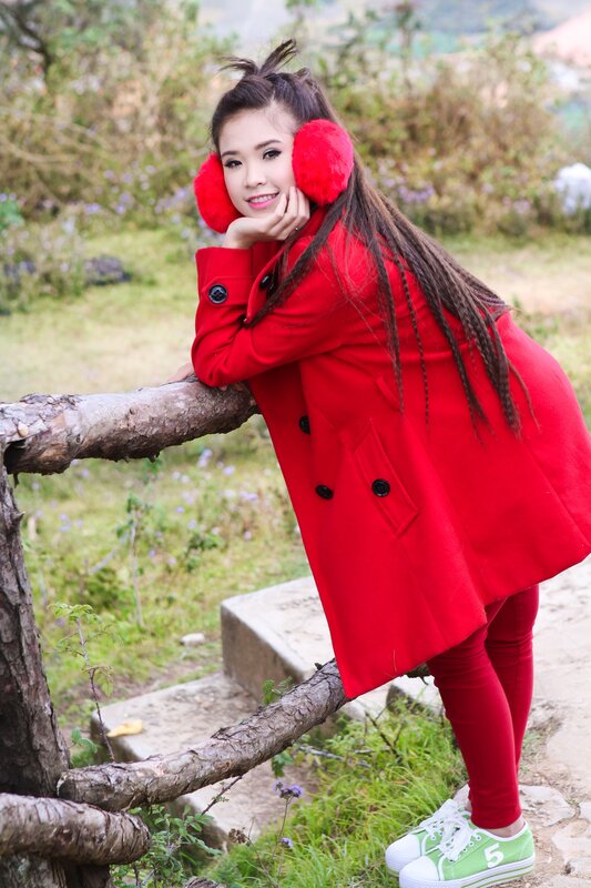 Woman in red coat outdoors
