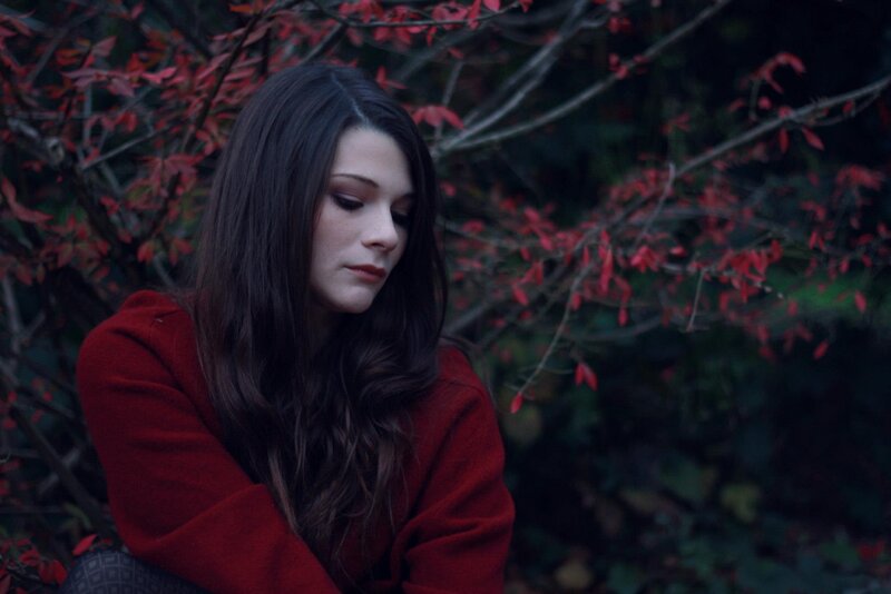 woman in red coat outdoors