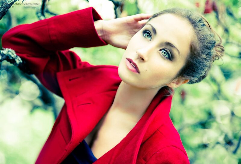 woman in red coat outdoors