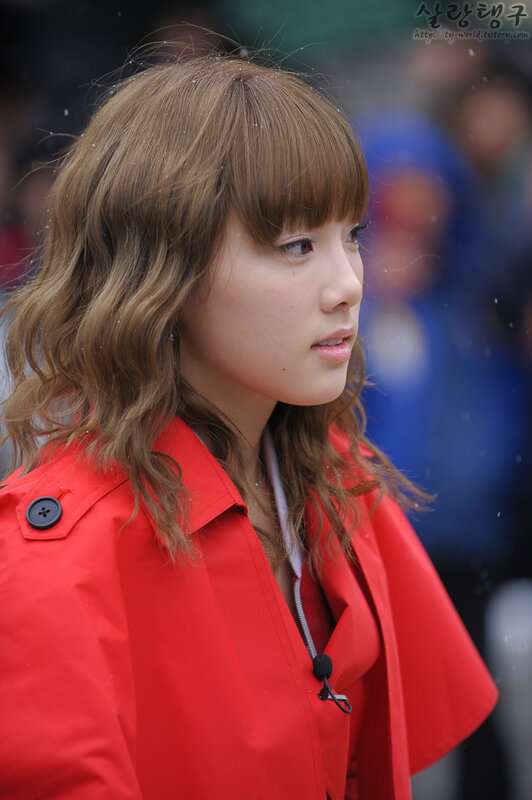 woman in red coat outdoors