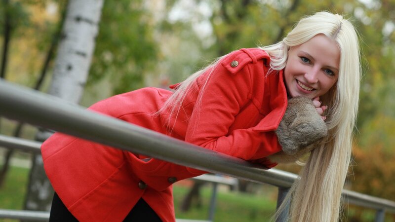 Woman in red coat smiling