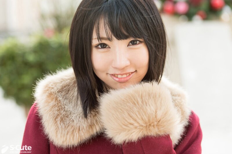 woman in red coat smiling