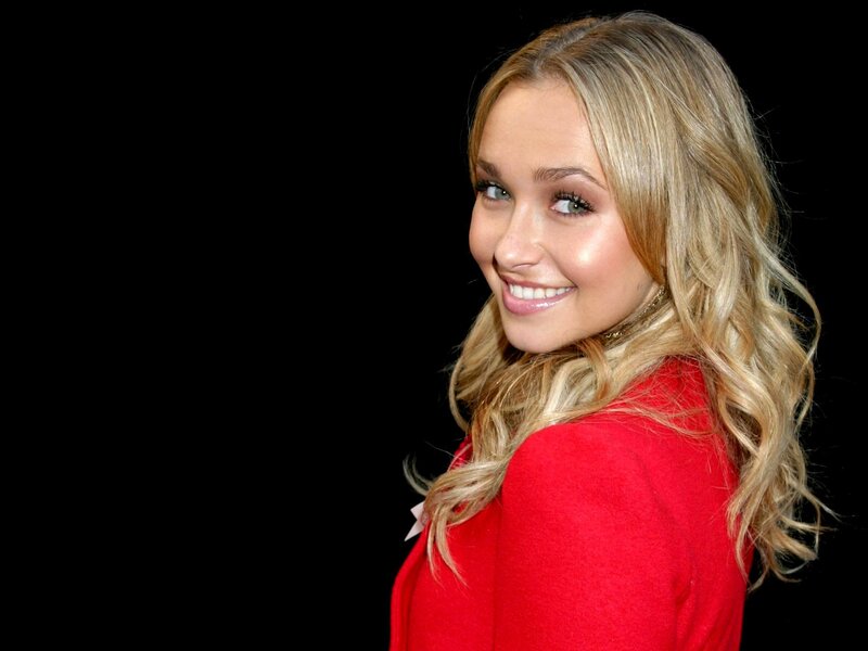 woman in red coat smiling