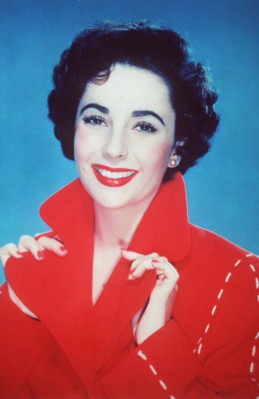 woman in red coat smiling