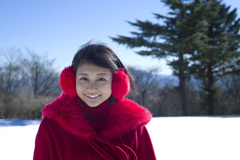 woman in red coat smiling