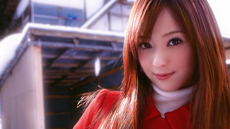 woman in red coat smiling