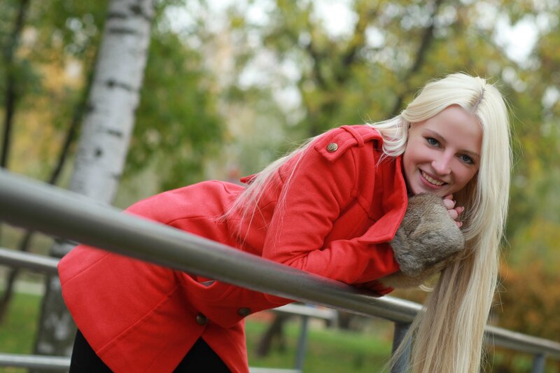 Woman in red coat smiling
